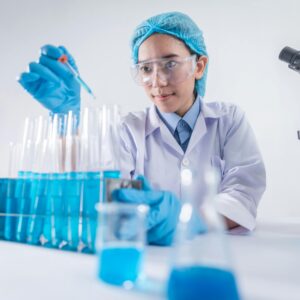 A female scientist using lab equipment for research in a modern laboratory setting.
